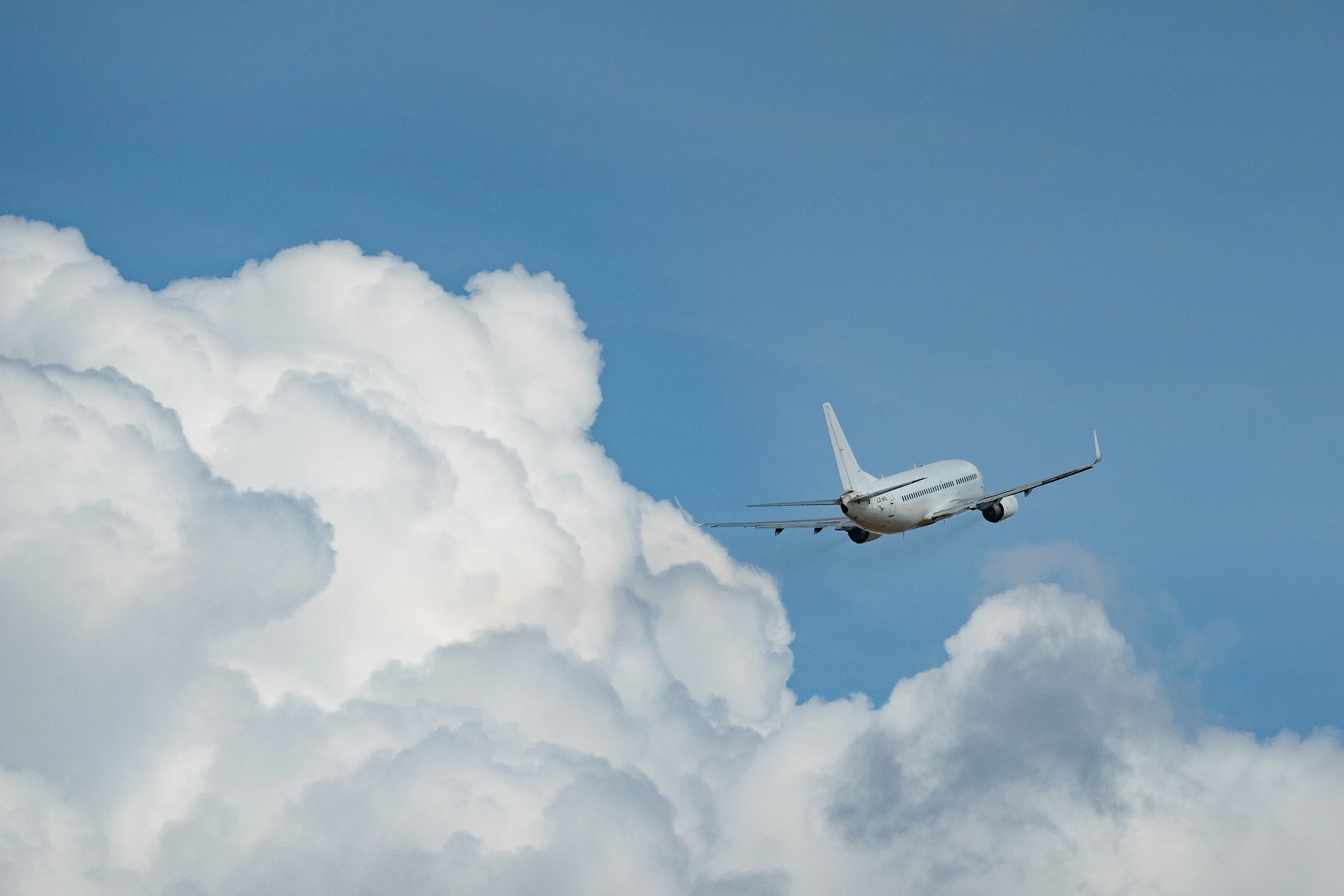 Commercial airplane flying through the sky